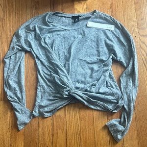 Woman’s gray long sleeve shirt
